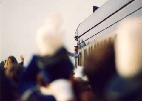 A photo of President George Bush waving to the crowd as he arrives for his Campaign '92 whistle-stop in Burlington, NC 