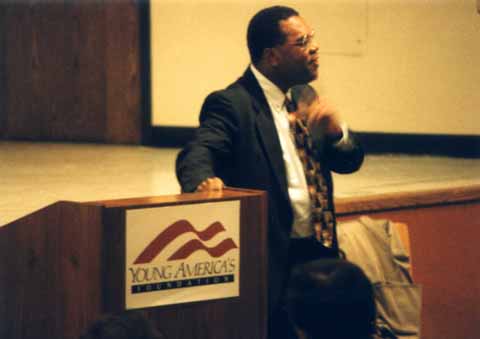 A photo of Horace Cooper making a point during his UNCG speech 